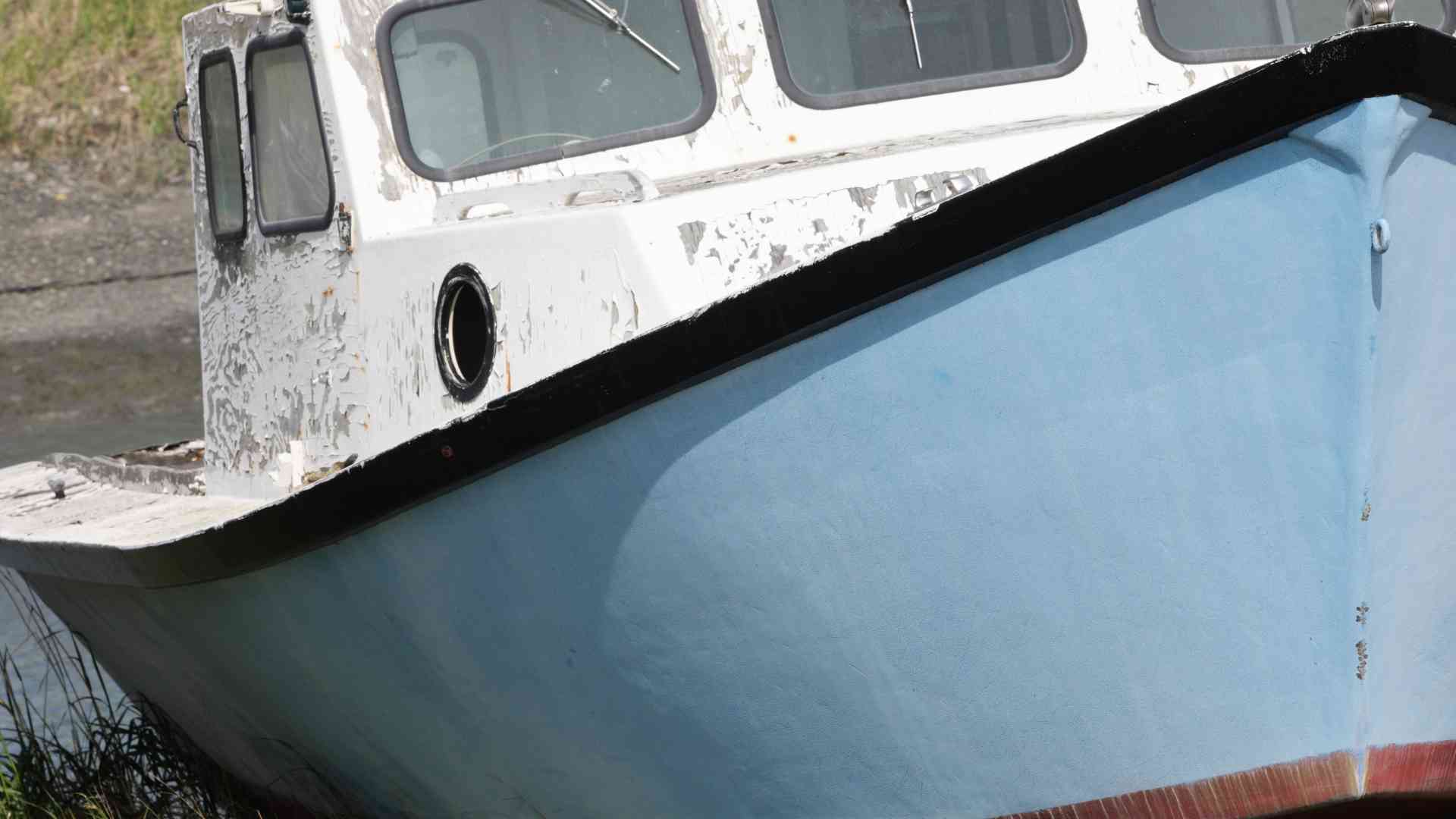 How can I prevent and treat osmotic blistering on a fiberglass boat hull