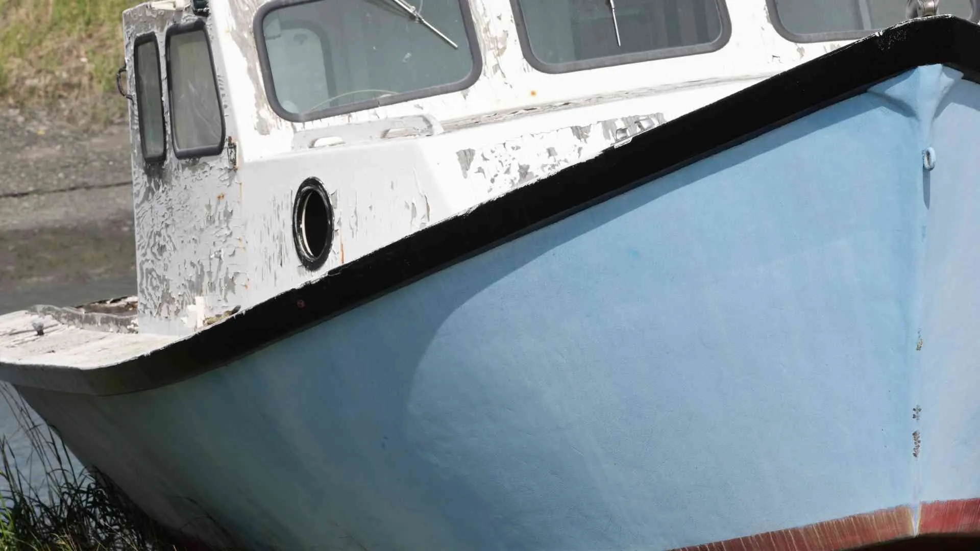 How can I prevent and treat osmotic blistering on a fiberglass boat hull