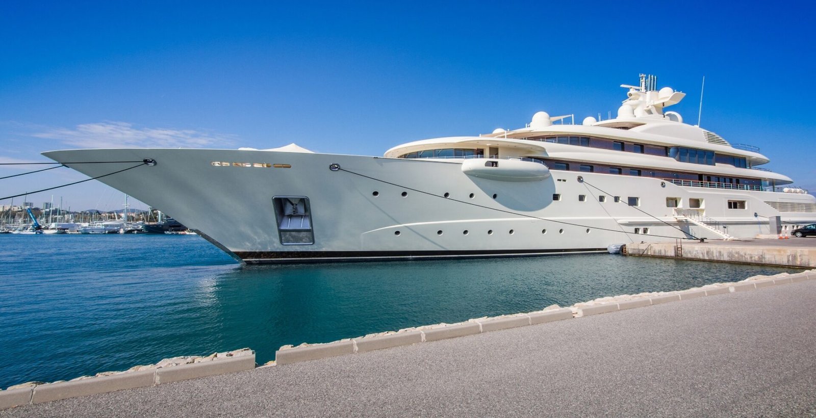 Gigantic big and large luxury mega or super motor yacht at dock