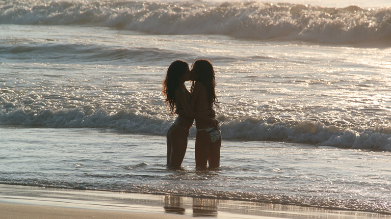 Brazilian Girls Kissing Away From the Shore